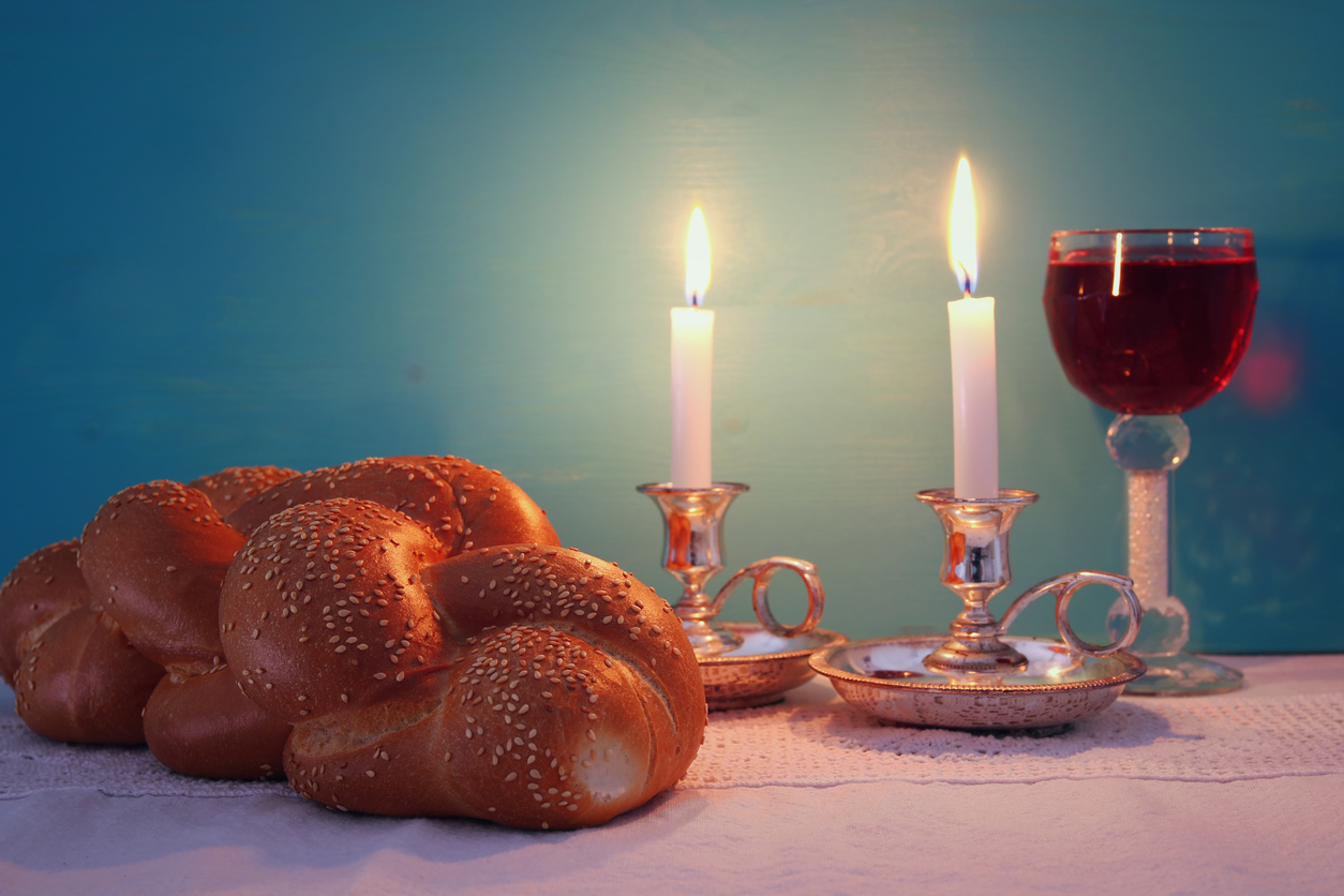 shabbat image. challah bread, shabbat wine and candelas
